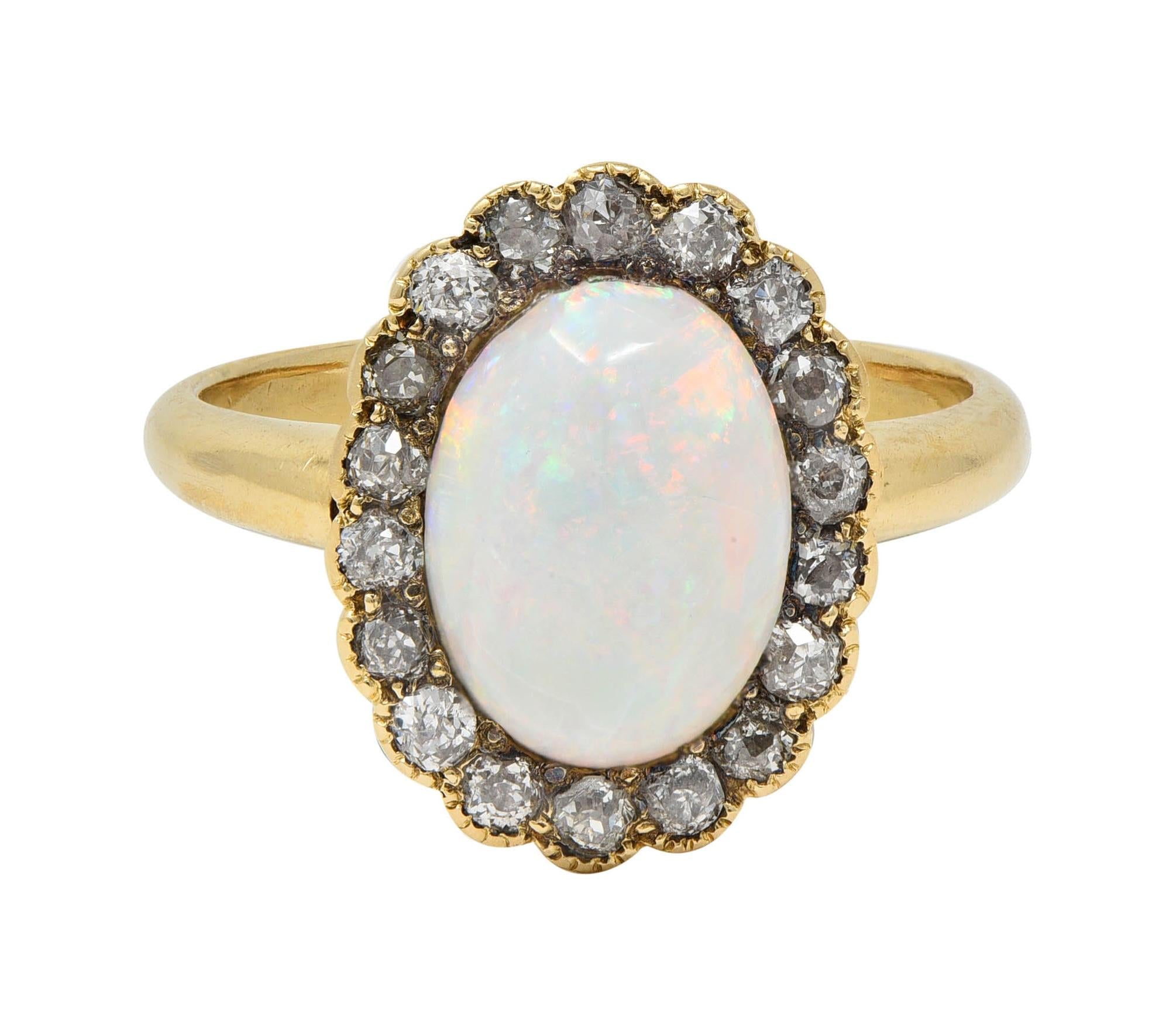 Early 1900's Opal Diamond 14 Karat Yellow Gold Antique Halo Ring