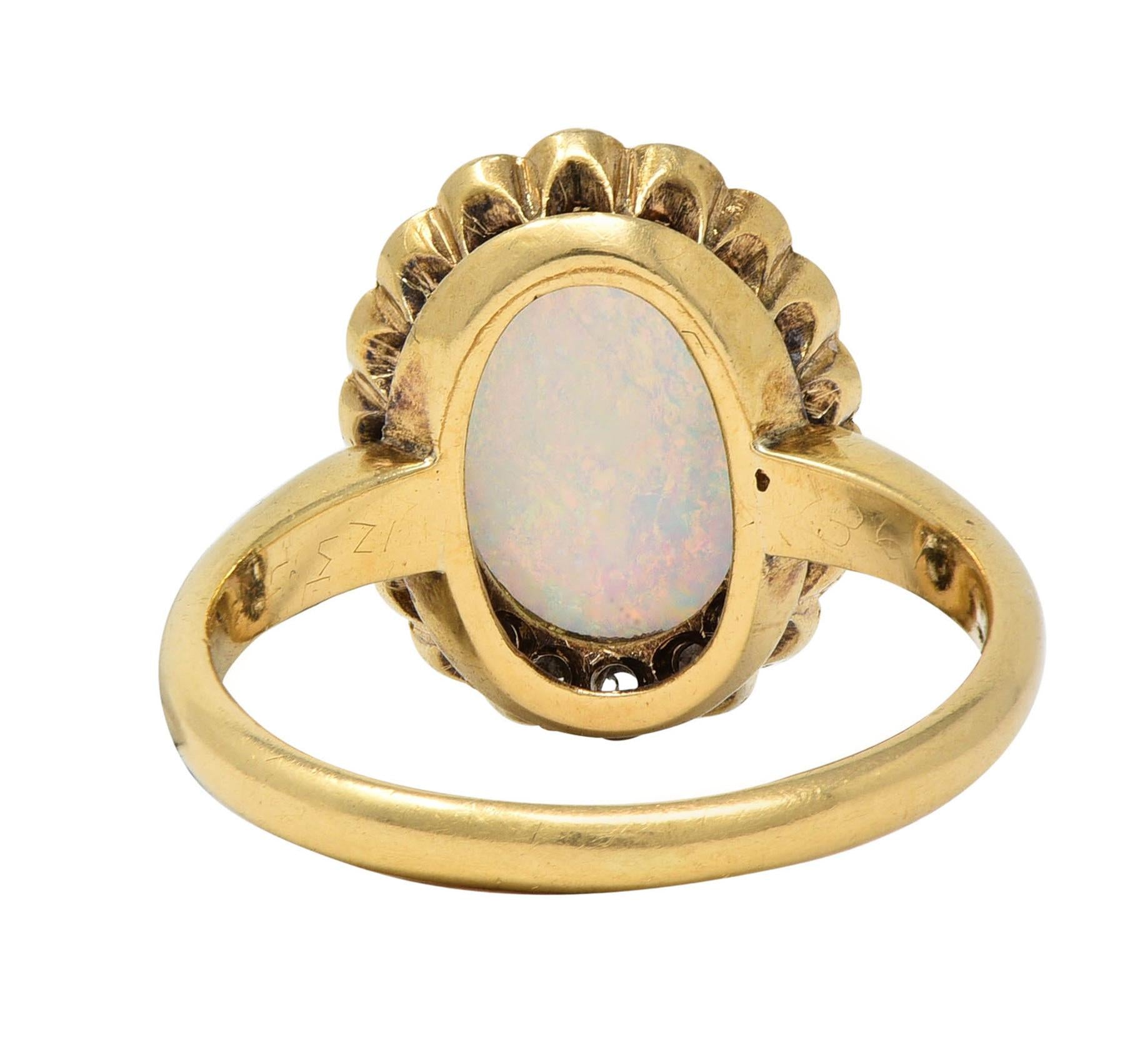 Early 1900's Opal Diamond 14 Karat Yellow Gold Antique Halo Ring