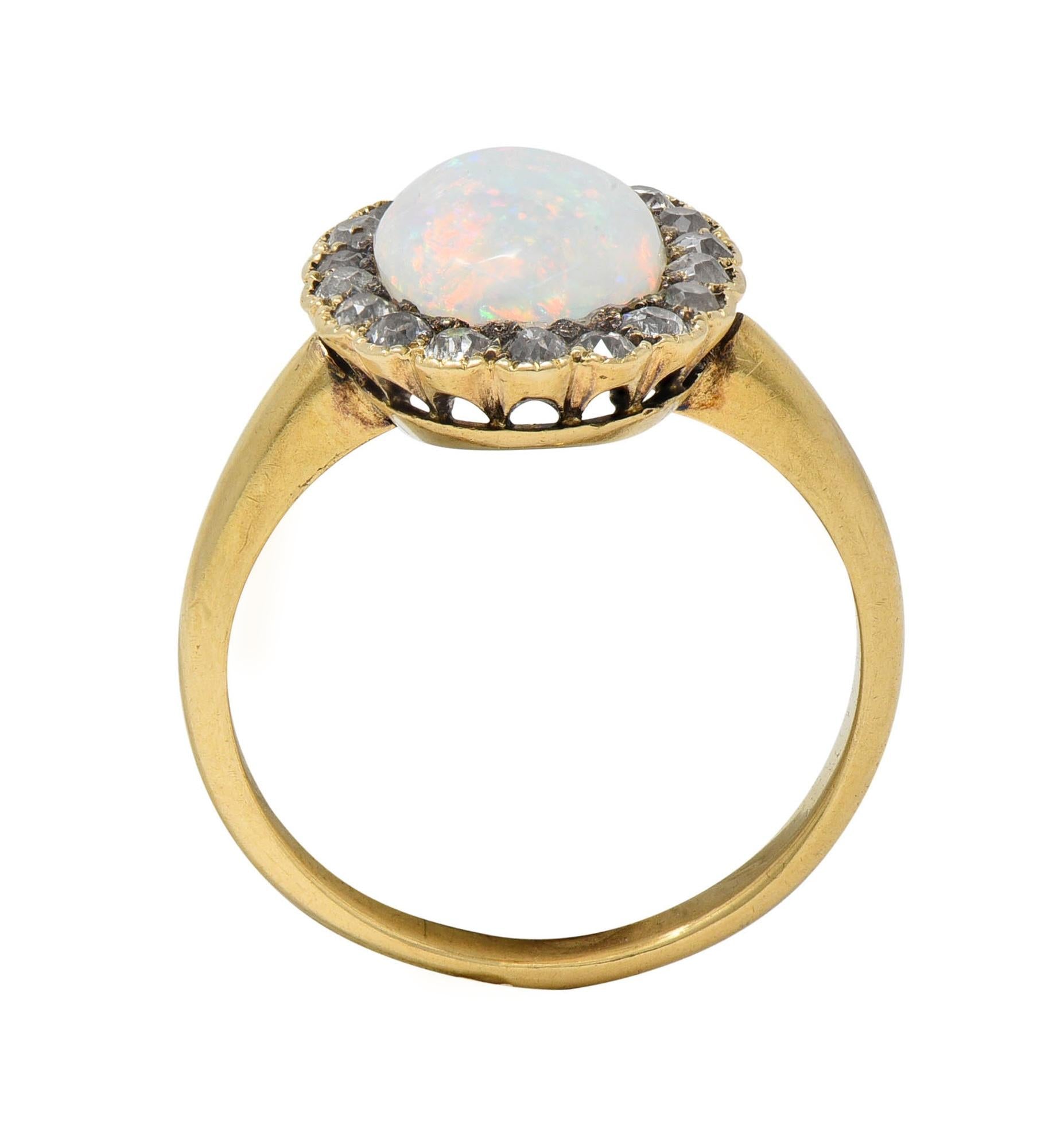 Early 1900's Opal Diamond 14 Karat Yellow Gold Antique Halo Ring
