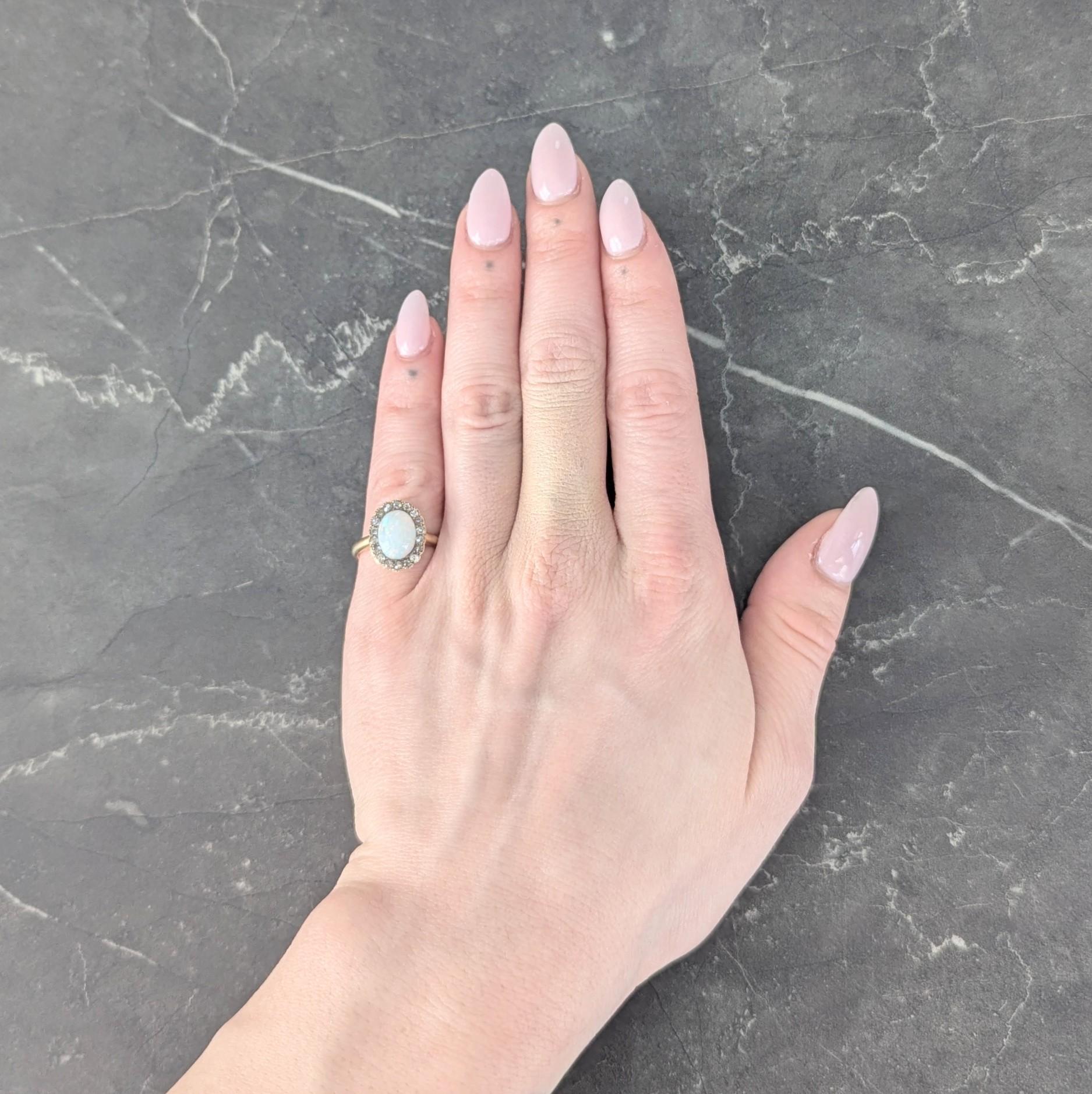 Early 1900's Opal Diamond 14 Karat Yellow Gold Antique Halo Ring