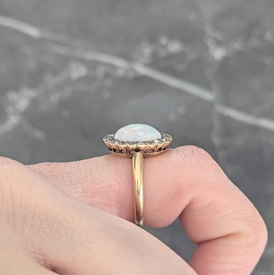 Early 1900's Opal Diamond 14 Karat Yellow Gold Antique Halo Ring