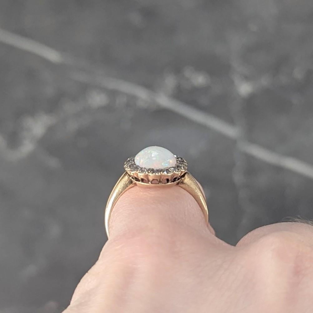 Early 1900's Opal Diamond 14 Karat Yellow Gold Antique Halo Ring