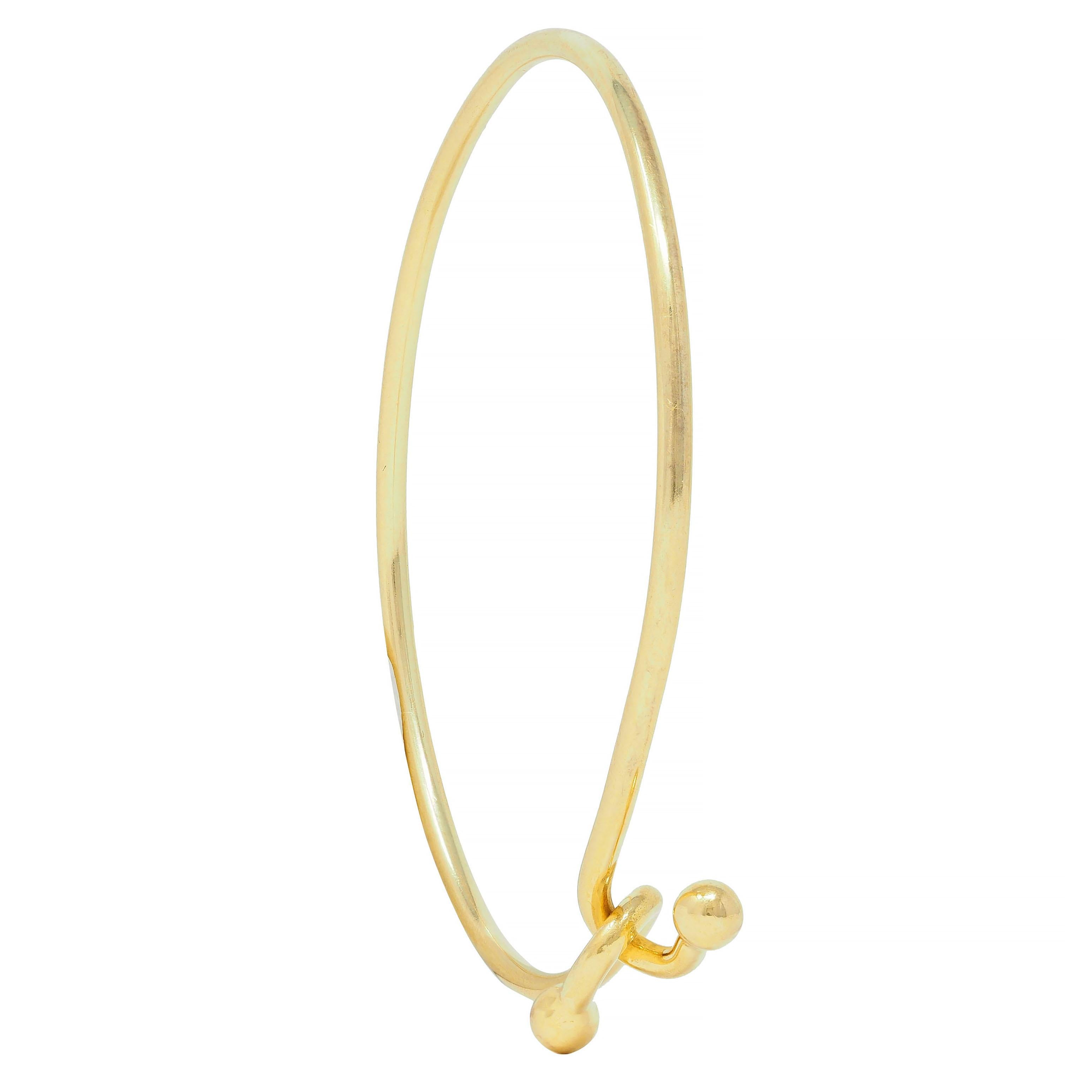 Tiffany & Co. 2000's 18 Karat Yellow Gold Interlocking Hook Bangle Bracelet