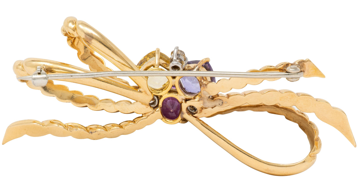 1960's Diamond Sapphire 14K Yellow Gold Platinum Vintage Twisted Bow Brooch