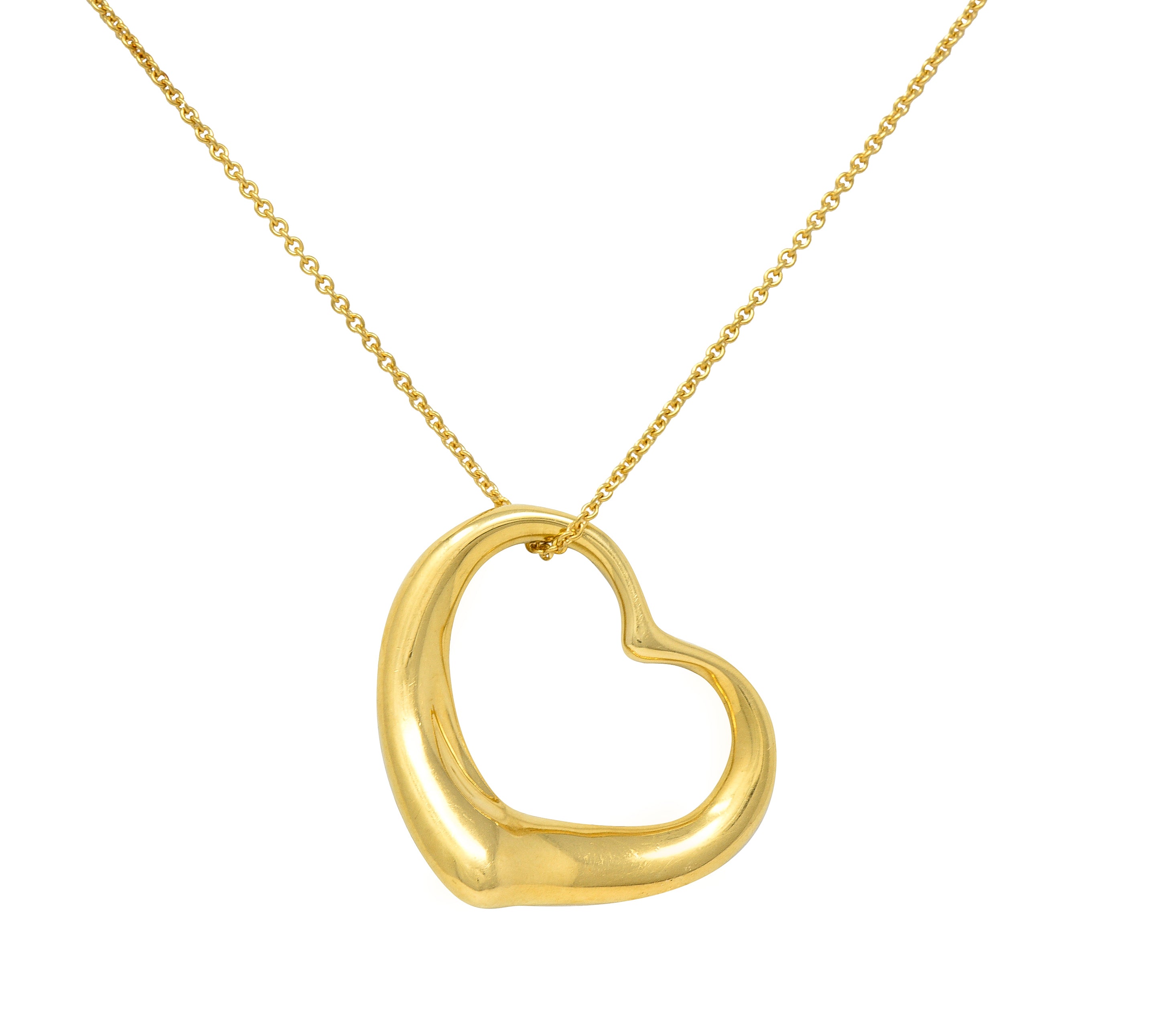 Elsa Peretti Tiffany & Co. 1990's 18 Karat Yellow Gold Open Heart Vintage Pendant Necklace Wilson's Estate Jewelry