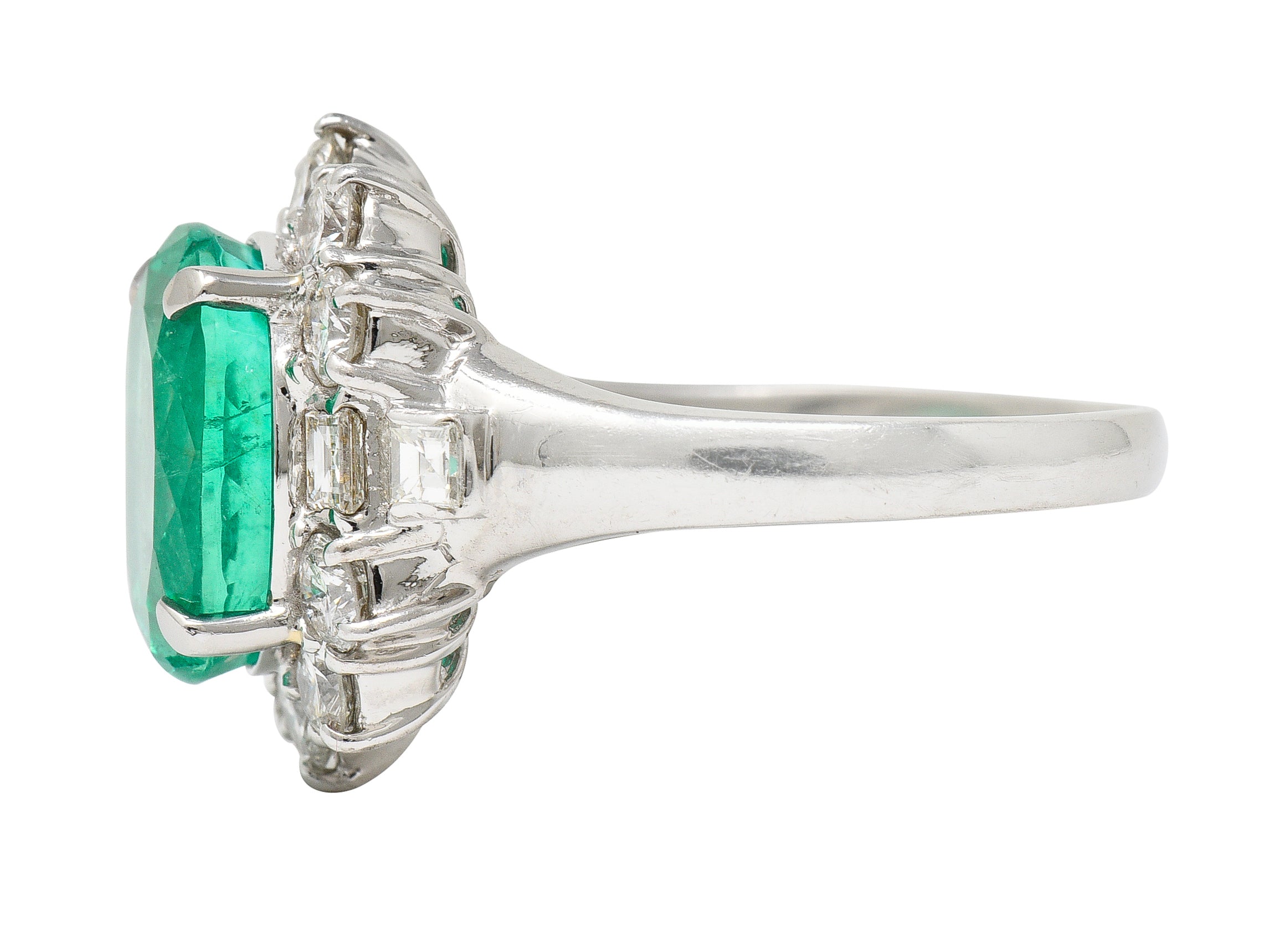 Contemporary 6.77 CTW Columbian Emerald Diamond Platinum Halo Ring GIA Wilson's Estate Jewelry