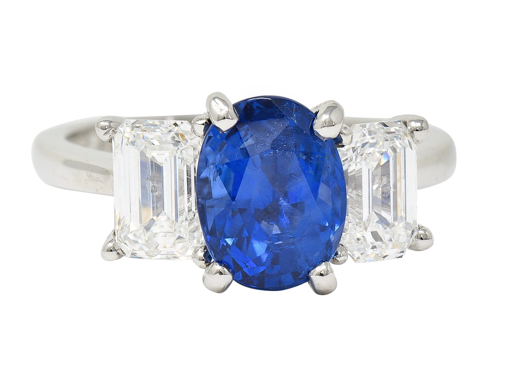 Contemporary 4.82 CTW Oval Cut No Heat Sapphire Emerald Cut Diamond Platinum Three Stone Ring GIA Wilson's Estate Jewelry