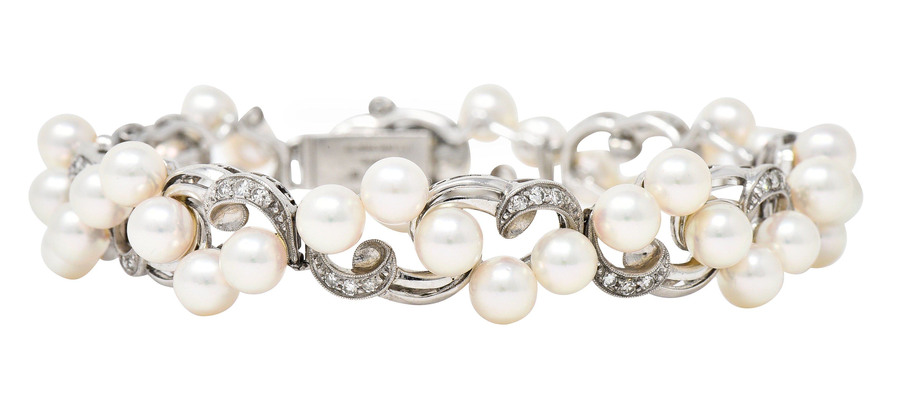 Mikimoto Mid-Century Diamond Cultured Pearl 14 Karat White Gold Scrolling Ribbon Vintage Bracelet Wilson's Estate Jewelry