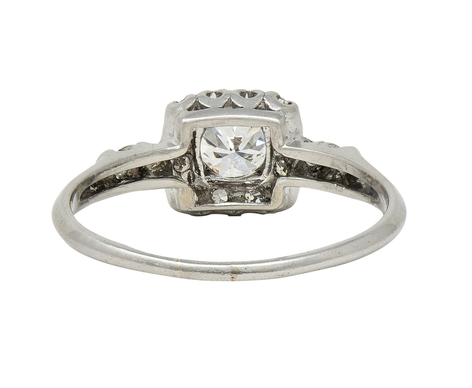 Mid-Century 0.62 CTW Diamond Platinum Halo Vintage Engagement Ring