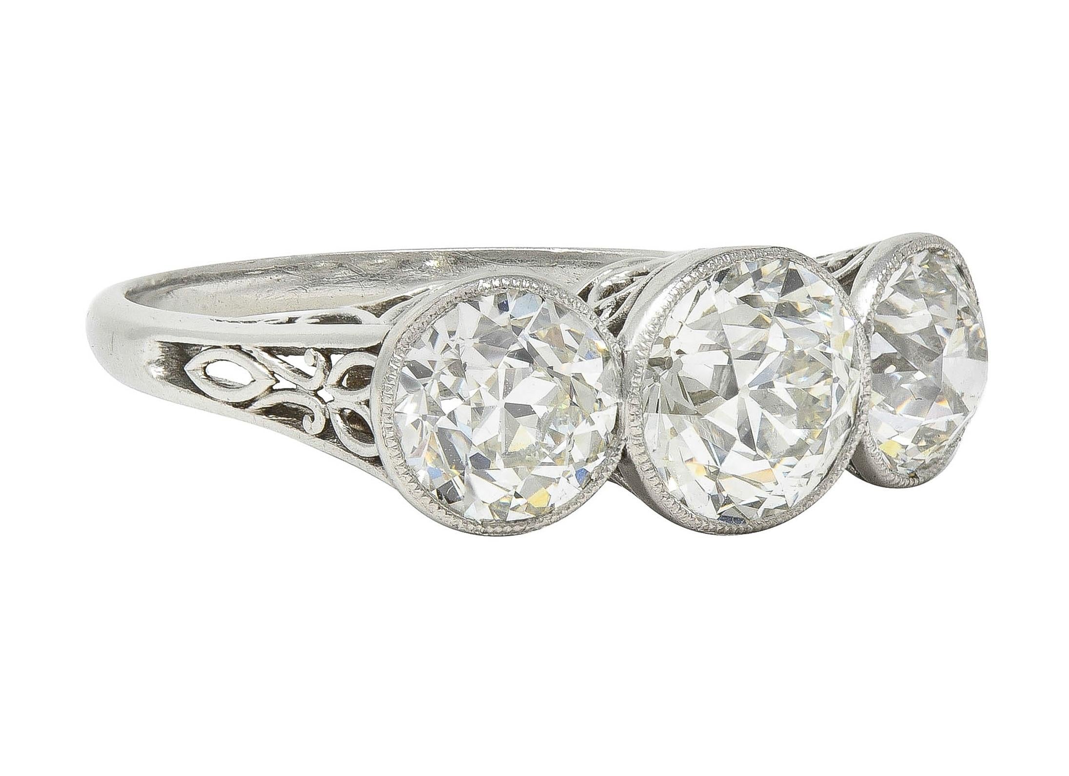 Edwardian 3.10 CTW Old Mine Cut Diamond Platinum Antique Three Stone Ring