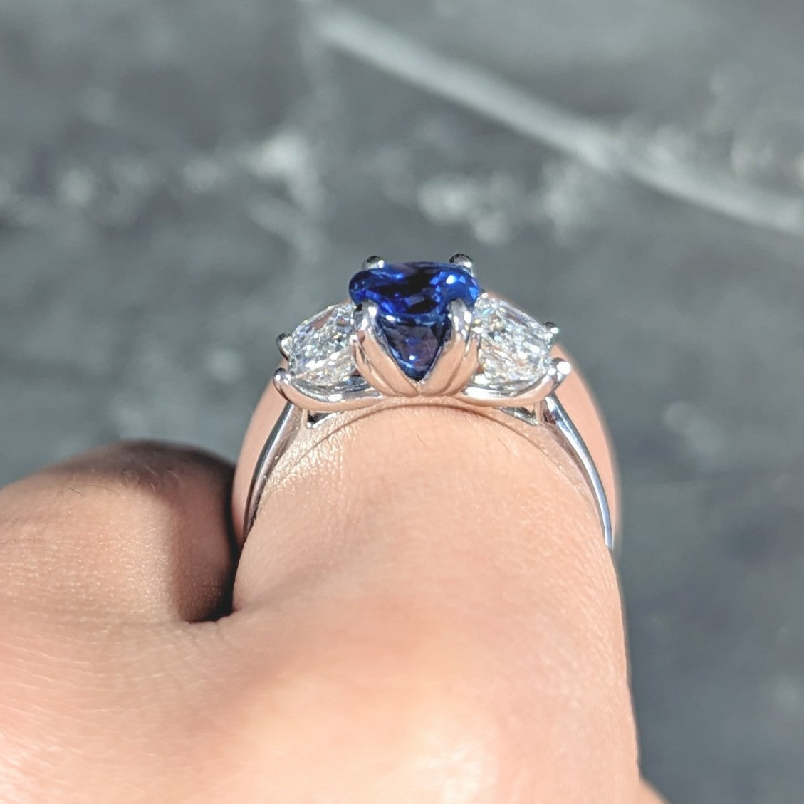 Contemporary 4.82 CTW Oval Cut No Heat Sapphire Emerald Cut Diamond Platinum Three Stone Ring GIA Wilson's Estate Jewelry