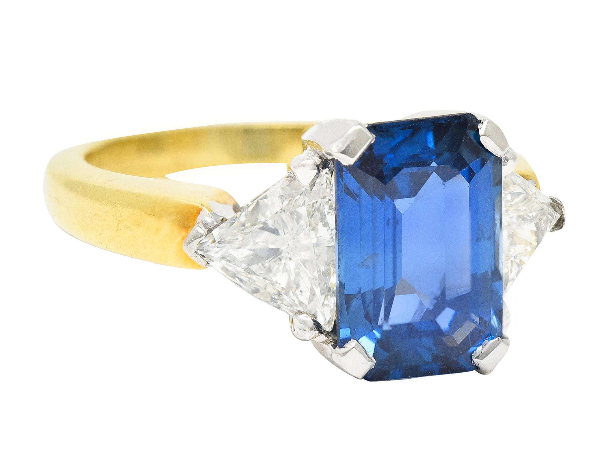 .11111 ## IS THIS A BETTER EDIT?SL 1980's 4.00 CTW Emerald Cut Sapphire Trillion Cut Diamond Platinum 18 Karat Yellow Gold Vintage Three Stone Ring Wilson's Estate Jewelry