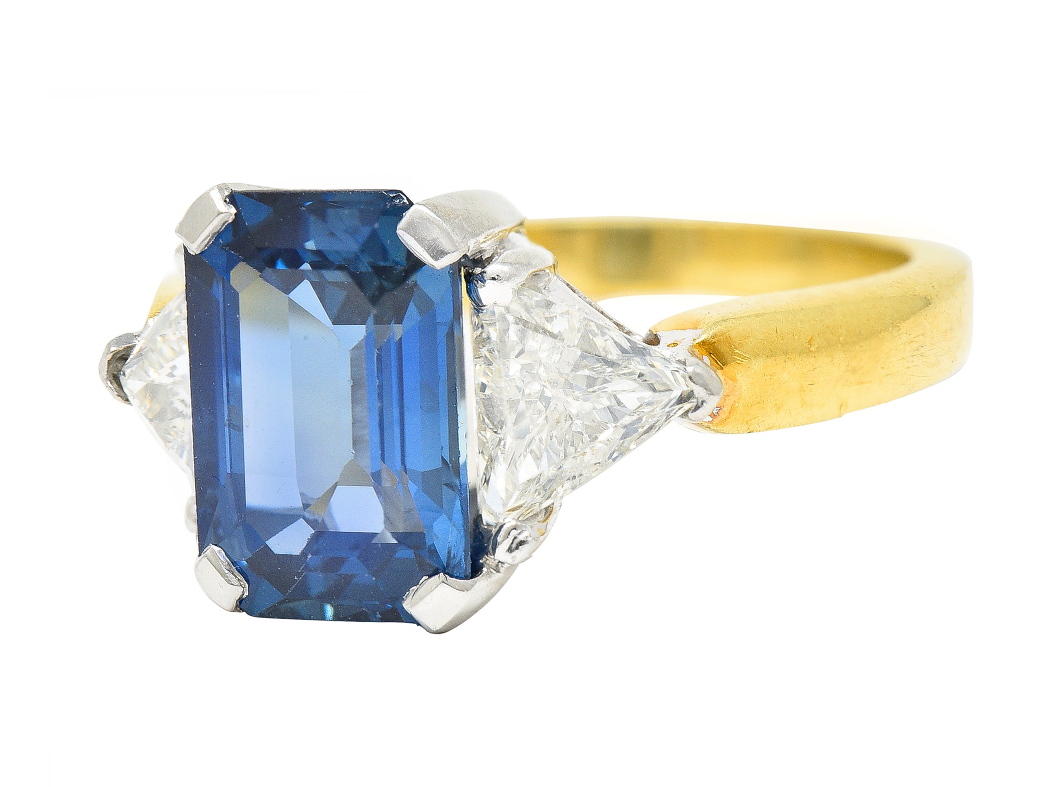 .11111 ## IS THIS A BETTER EDIT?SL 1980's 4.00 CTW Emerald Cut Sapphire Trillion Cut Diamond Platinum 18 Karat Yellow Gold Vintage Three Stone Ring Wilson's Estate Jewelry