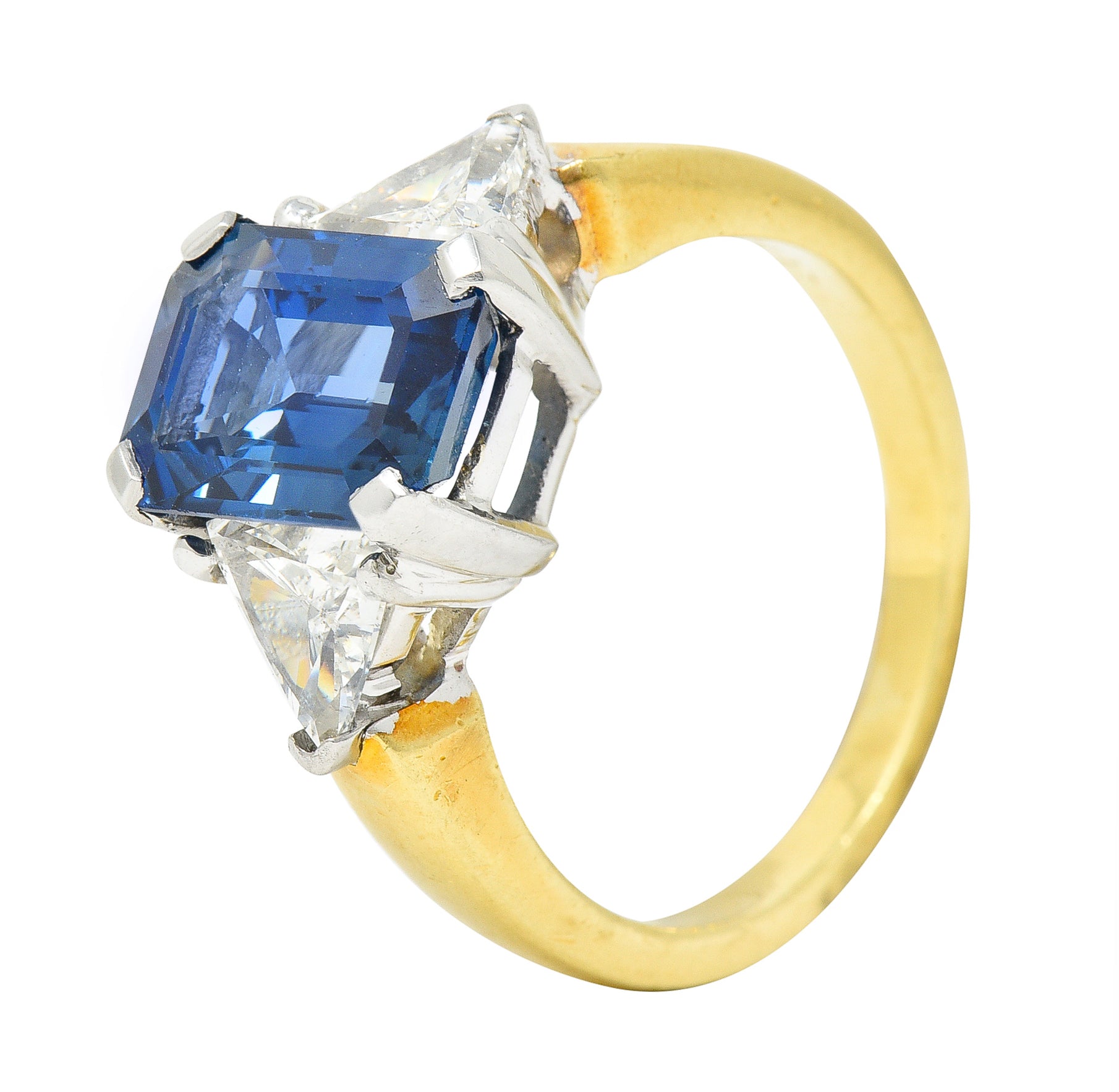 .11111 ## IS THIS A BETTER EDIT?SL 1980's 4.00 CTW Emerald Cut Sapphire Trillion Cut Diamond Platinum 18 Karat Yellow Gold Vintage Three Stone Ring Wilson's Estate Jewelry