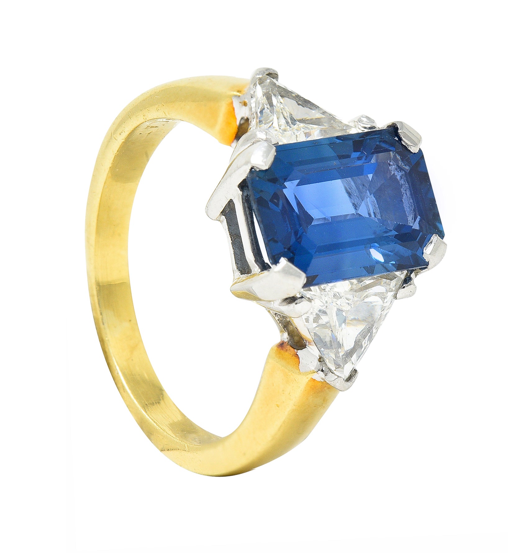 .11111 ## IS THIS A BETTER EDIT?SL 1980's 4.00 CTW Emerald Cut Sapphire Trillion Cut Diamond Platinum 18 Karat Yellow Gold Vintage Three Stone Ring Wilson's Estate Jewelry