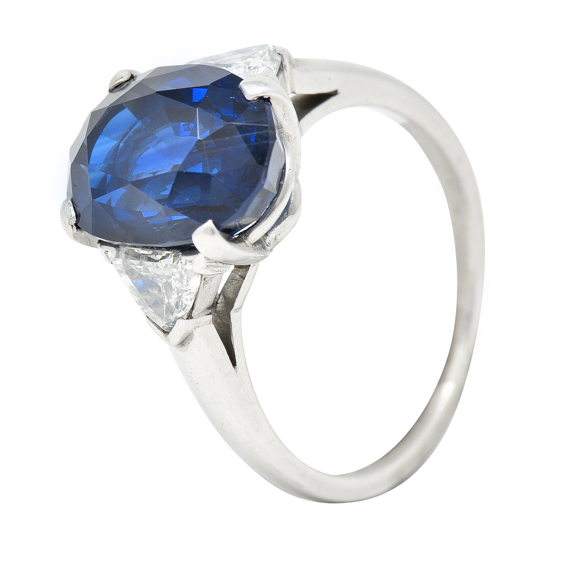 Mid-Century 7.13 CTW Oval Cut No-Heat Thai Sapphire Trillion Cut Diamond Platinum Vintage Three Stone Ring GIA Wilson's Estate Jewelry