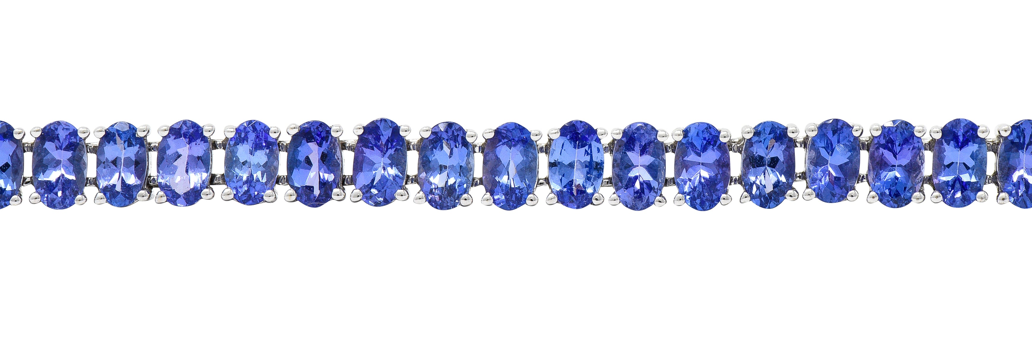 Contemporary 12.00 CTW Oval Cut Tanzanite 14 Karat White Gold Line Bracelet Wilson's Estate Jewelry