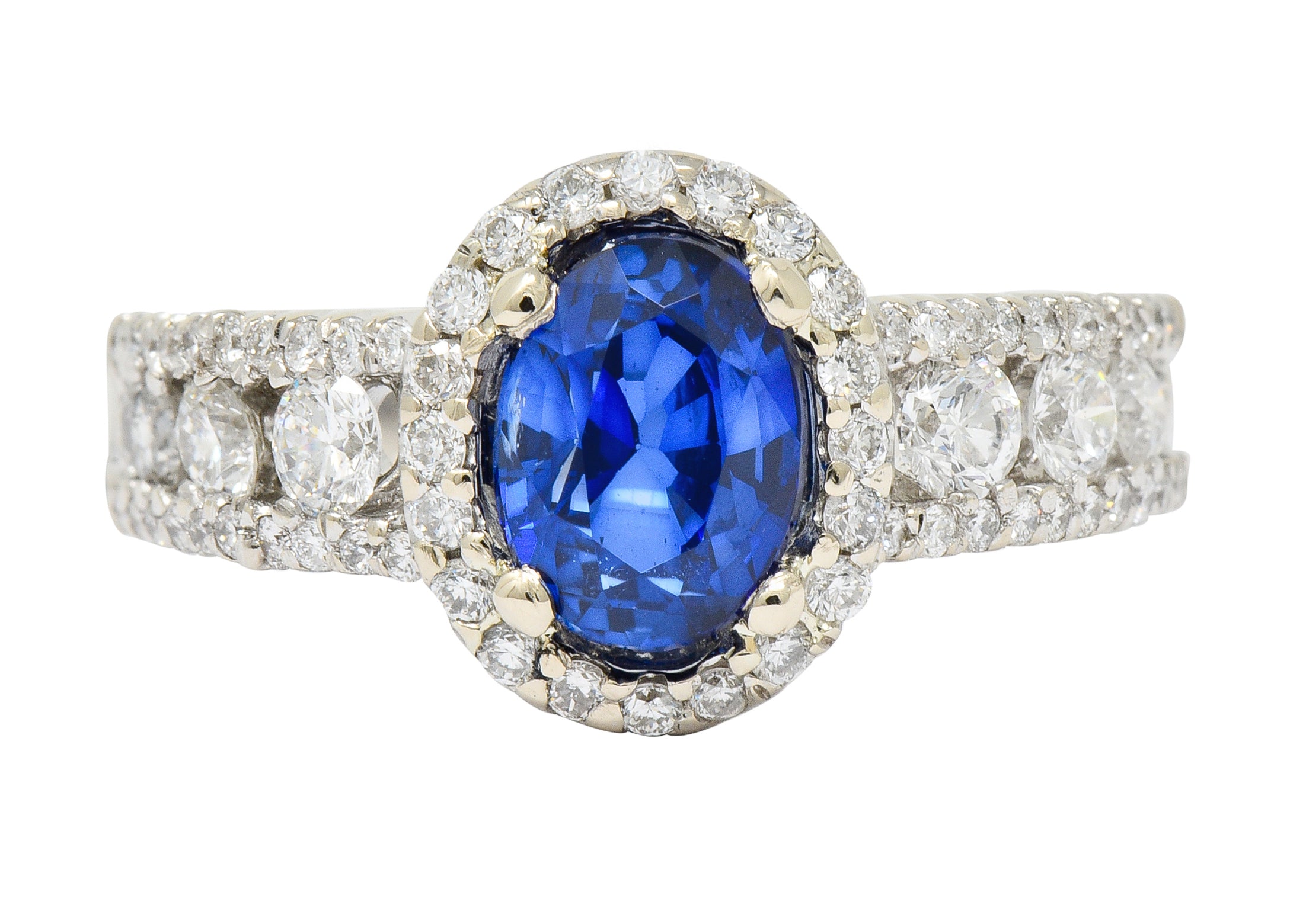 Contemporary 2.31 CTW Sapphire Diamond 18 Karat White Gold Halo Ring - Wilson's Estate Jewelry