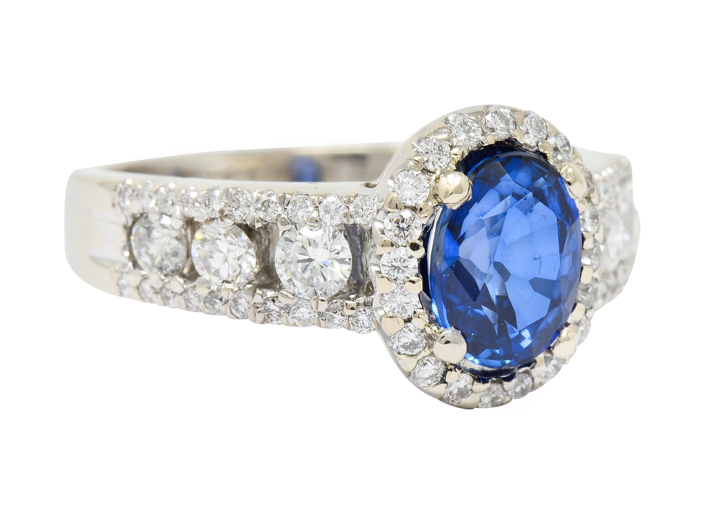 Contemporary 2.31 CTW Sapphire Diamond 18 Karat White Gold Halo Ring - Wilson's Estate Jewelry