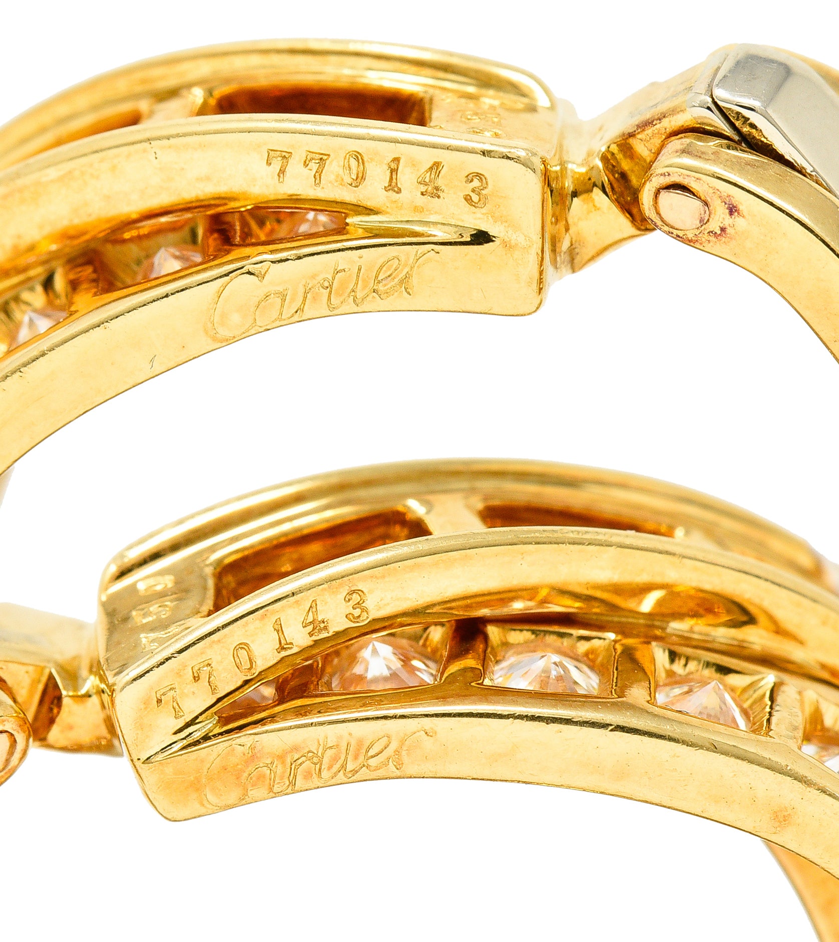 Cartier French 1990's 6.15 CTW Diamond 18 Karat Yellow Gold Twisting Trinity Inside/Outside J-Hoop Vintage Earrings Wilson's Estate Jewelry