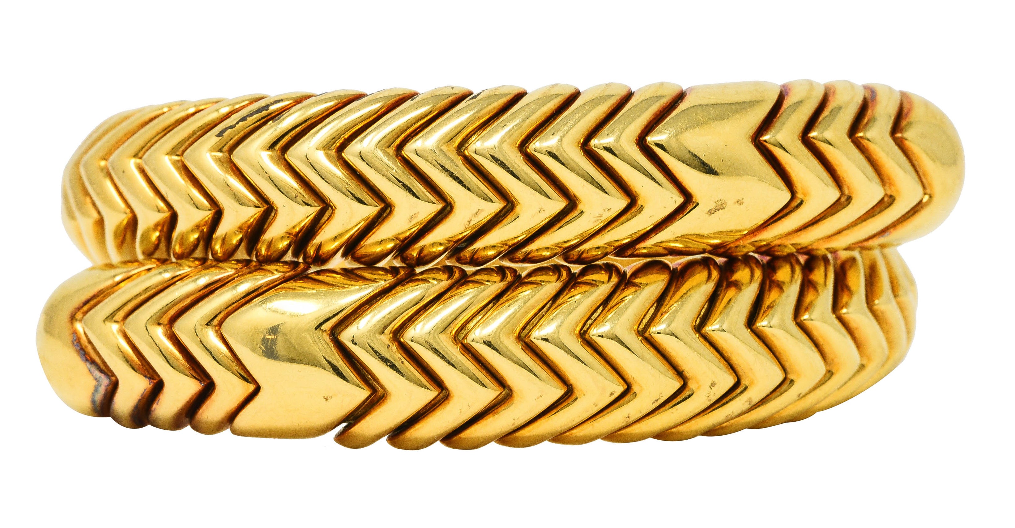 Bulgari 1990's 18 Karat Yellow Gold Chevron Spiga Wrap Vintage Bangle Bracelet Wilson's Estate Jewelry