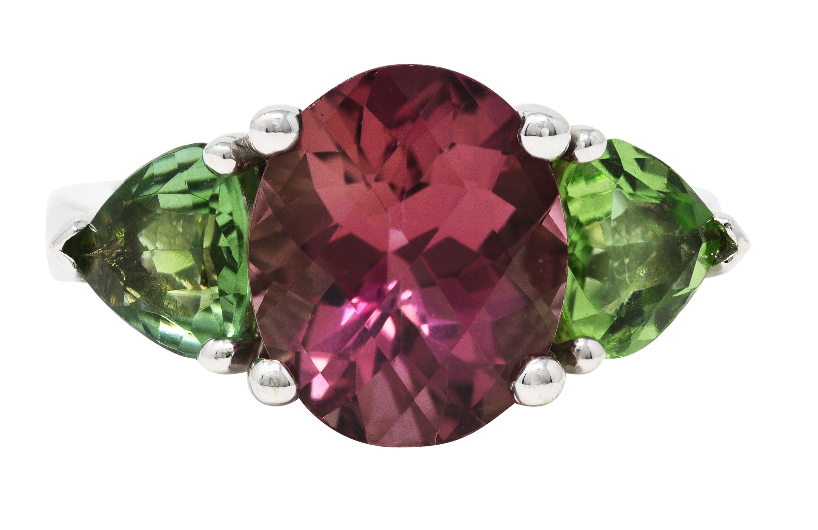 Contemporary 7.23 CTW Oval Cut Pink Tourmaline Peridot 18 Karat White Gold Three Stone Ring Wilson's Estate Jewelry