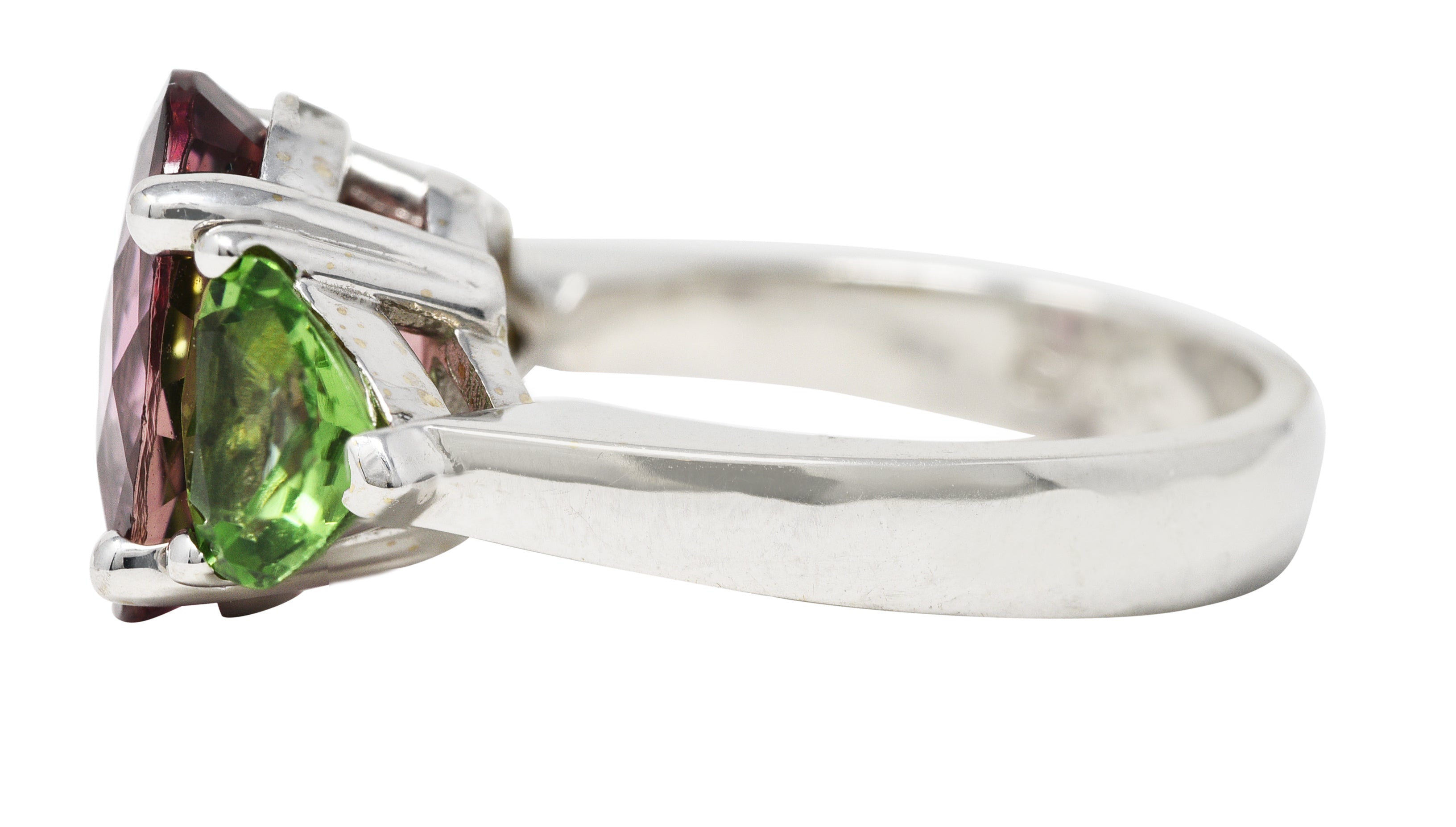 Contemporary 7.23 CTW Oval Cut Pink Tourmaline Peridot 18 Karat White Gold Three Stone Ring Wilson's Estate Jewelry