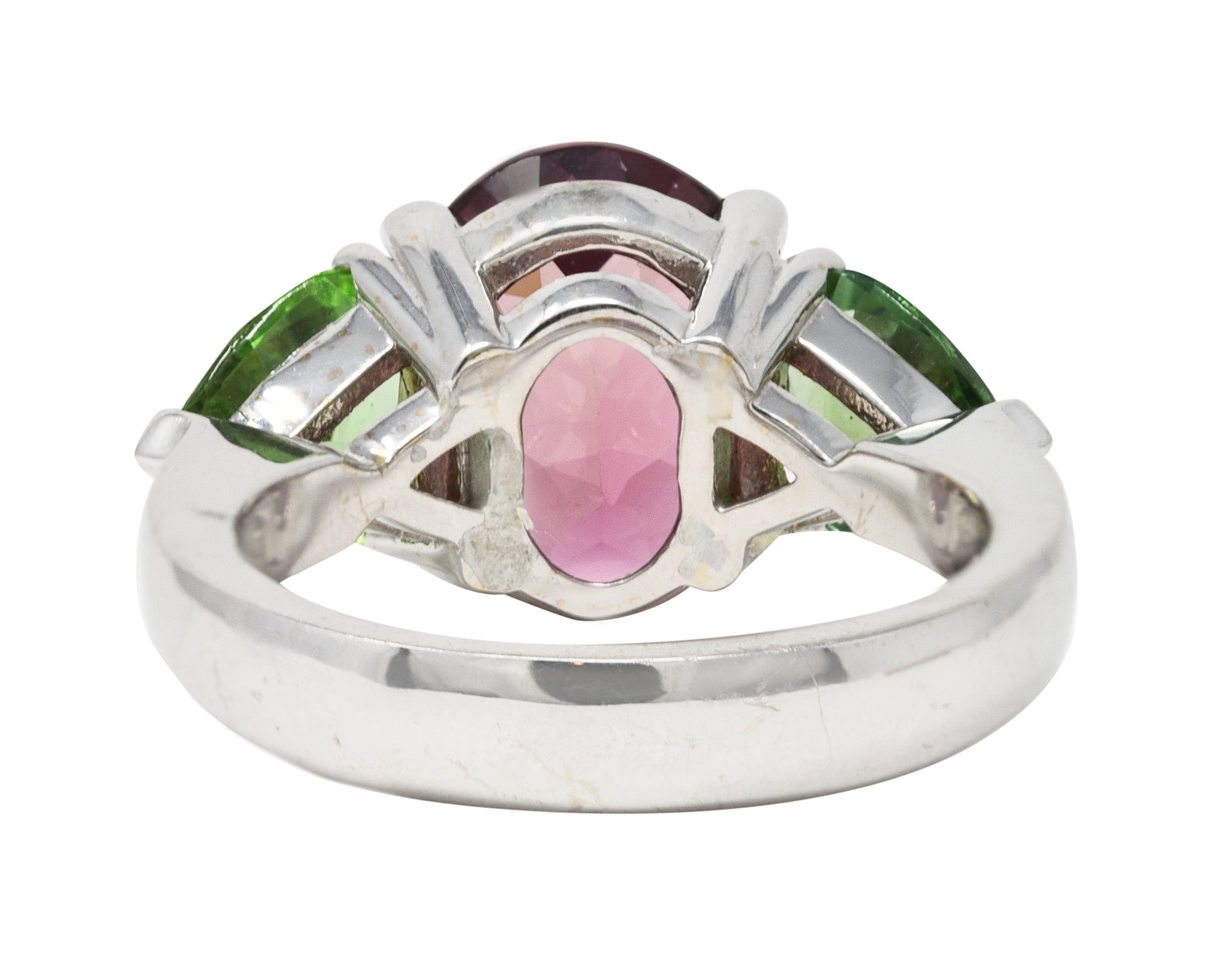 Contemporary 7.23 CTW Oval Cut Pink Tourmaline Peridot 18 Karat White Gold Three Stone Ring Wilson's Estate Jewelry