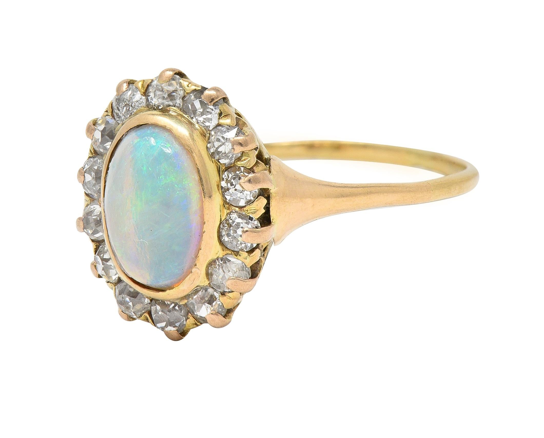 Victorian 0.86 CTW Opal Cabochon Diamond 14 Karat Yellow Gold Antique Halo Ring